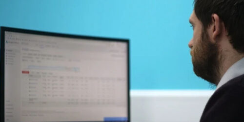 A man looking at a computer screen