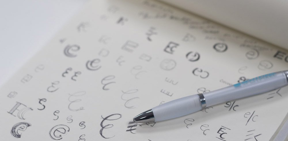 image of a notebook with letters written on it and a pen on top