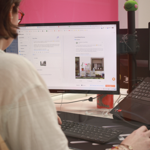 A person at a desk working on a computer