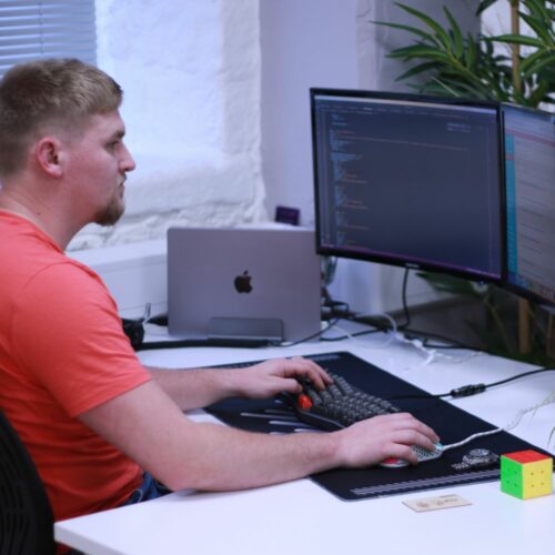 Ash working on a computer