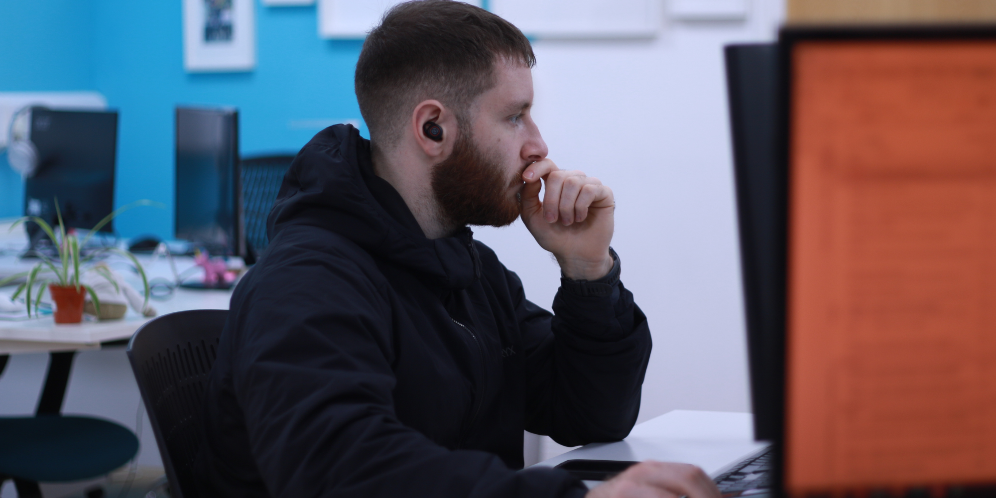 Tom working on a computer