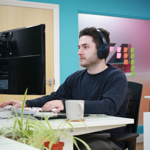 Sam working on a computer