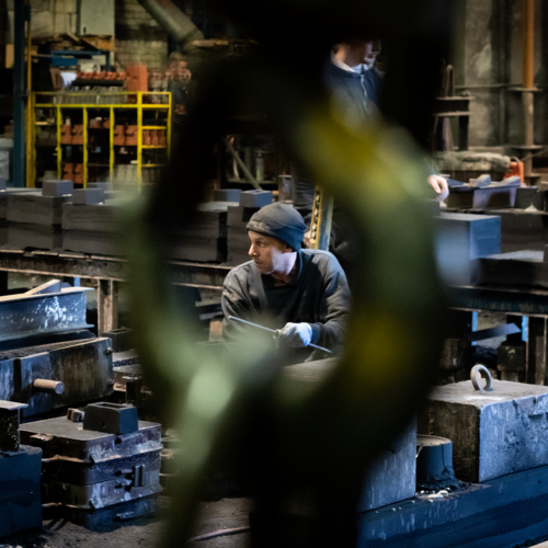 A person working with metals