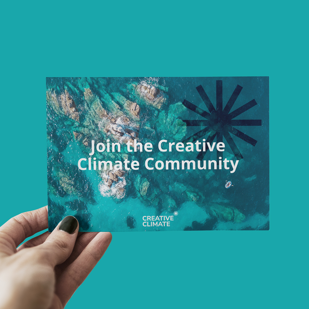 A postcard with the text 'Join the Creative Climate Community' and logo