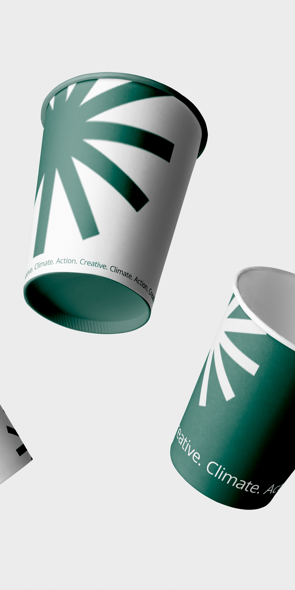 Two paper cups with the Creative Climate logo and branding