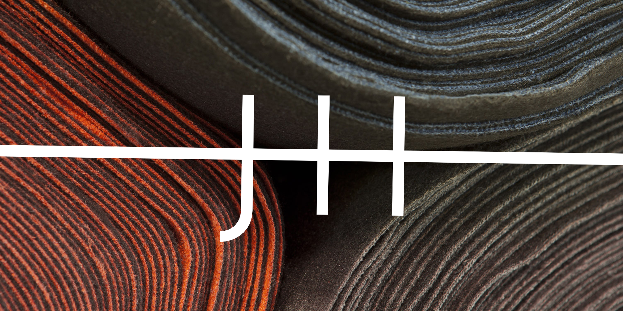 JH logo over fabric rolls