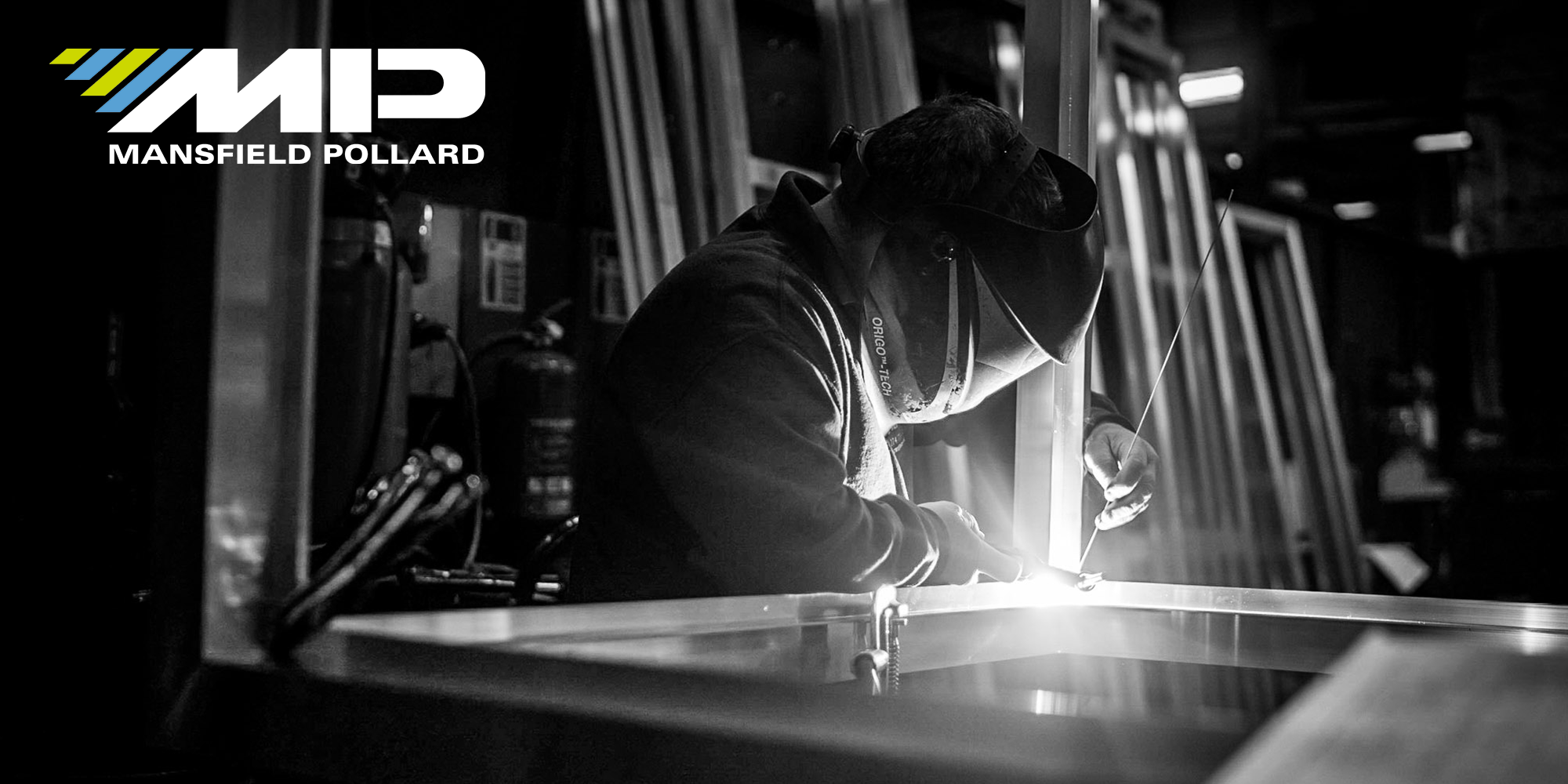 Image of a person welding with the MP logo in the top left corner