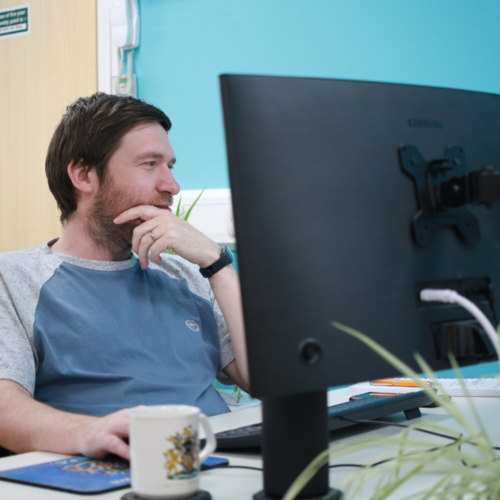 Greg working on a computer