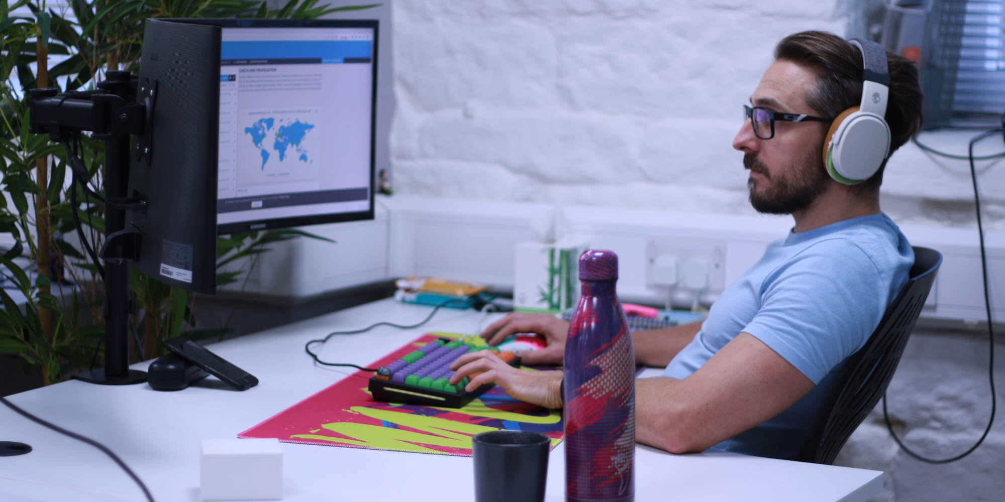 Jon looking at two computer screens