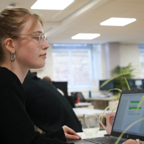 Martyna working on a laptop