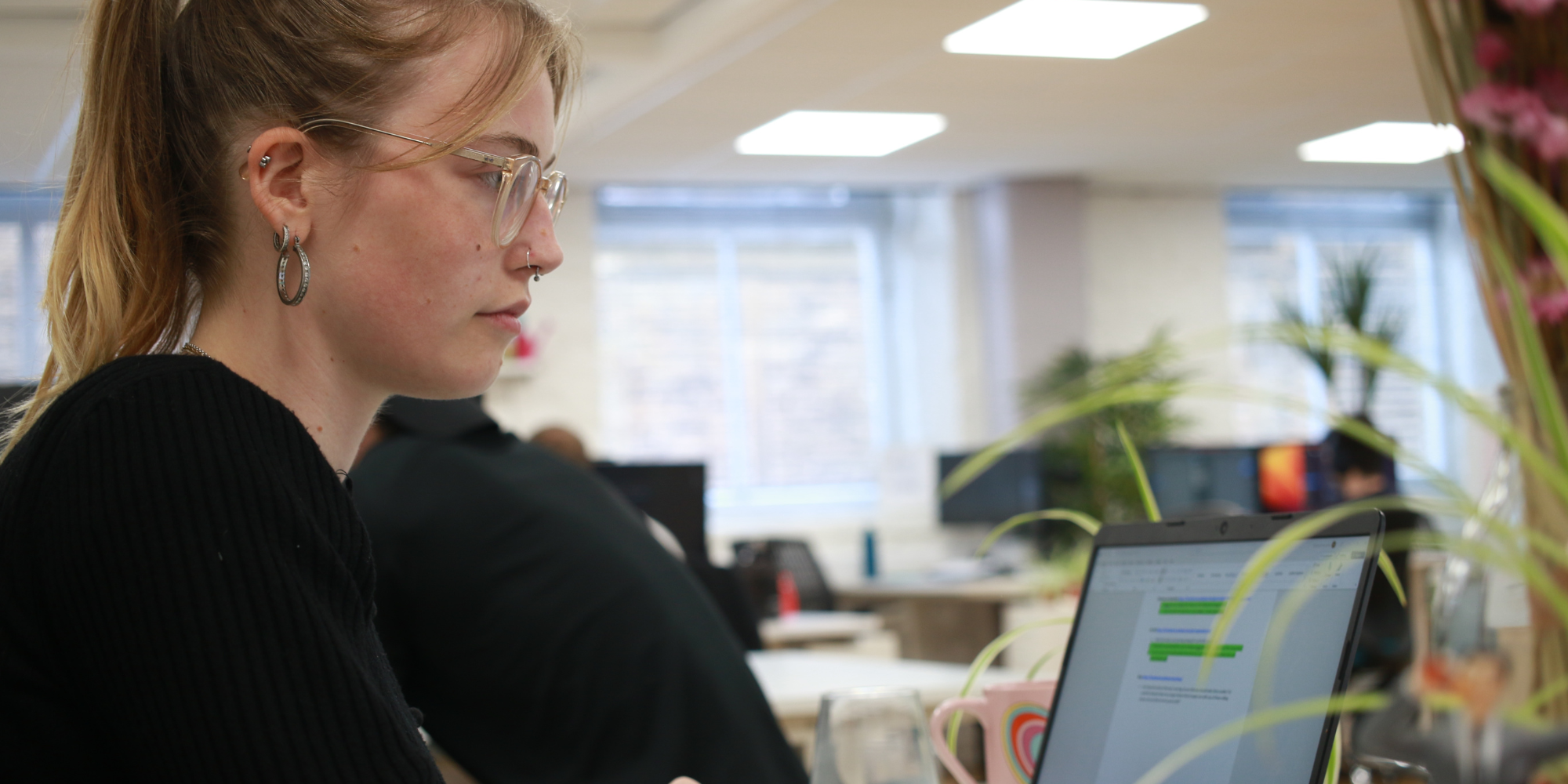 Martyna working on a laptop