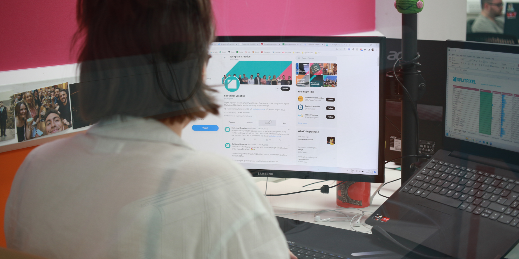 A person looking at two computer screens