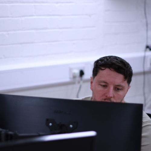 A man looking at a computer screen