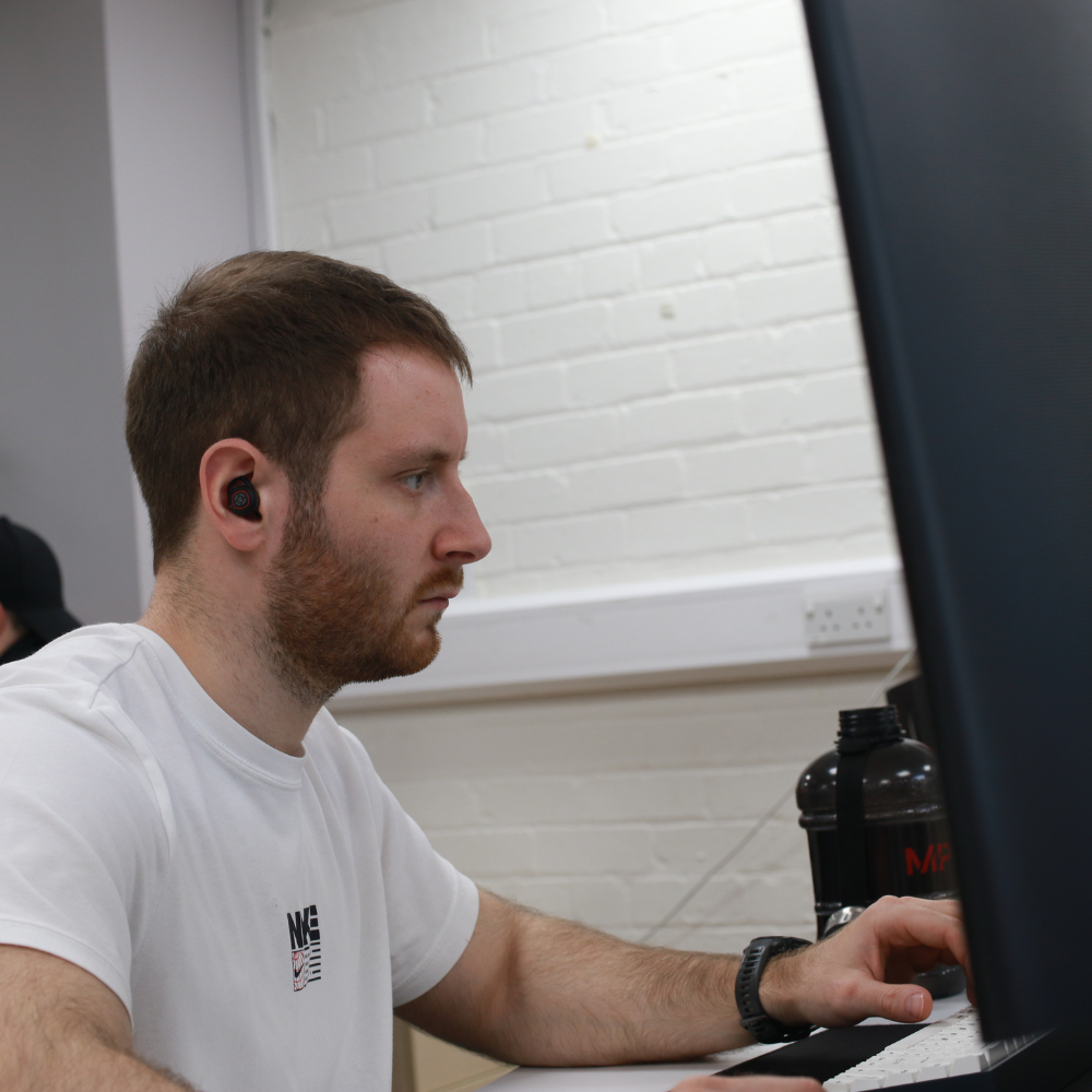 A man looking at a computer screen