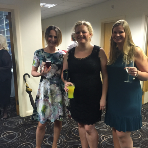 Three splitpixel employees, in dresses at an event in 2015