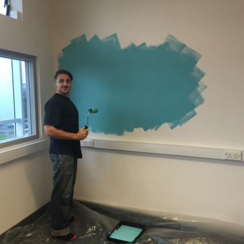 Jon painting the office in 2015