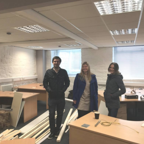 Greg, Amy and Charlie in the office before it's renovations in 2017