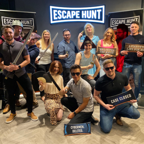 The Splitpixel staff with swords and pirate props at an escape room